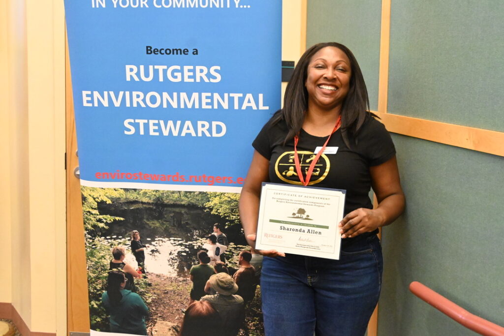 a woman receiving her certification award. 