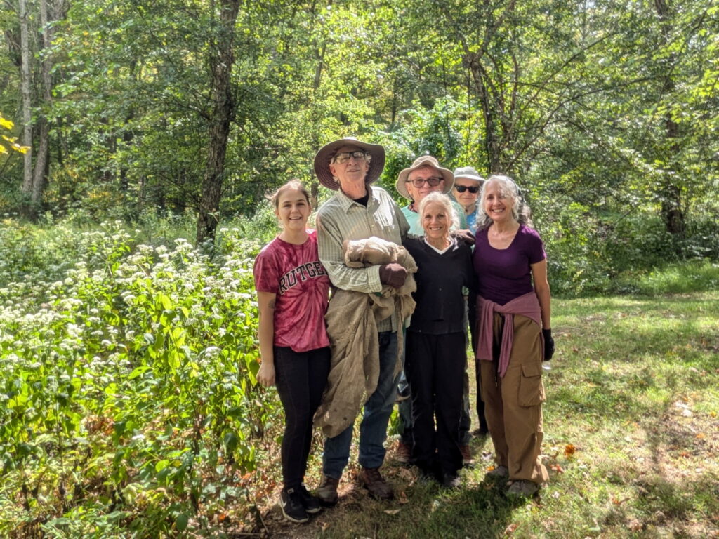a small group of volunteers posing for the photo